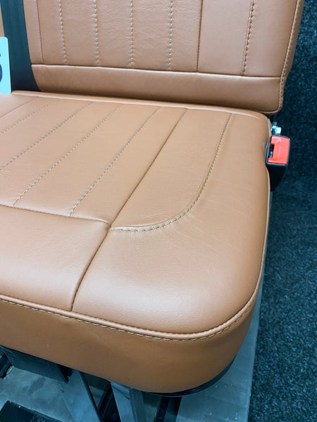 Rock & Roll Bed 3/4 M1 Tested 2 Seater, close-up of brown real leather seat base with vertical stitching and rounded corner detail.