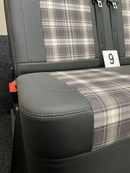 Rock & Roll Bed 3/4 M1 Tested 2 Seater, angled close-up of seat base with tartan centre panel, black leatherette edge, and grey stitching.
