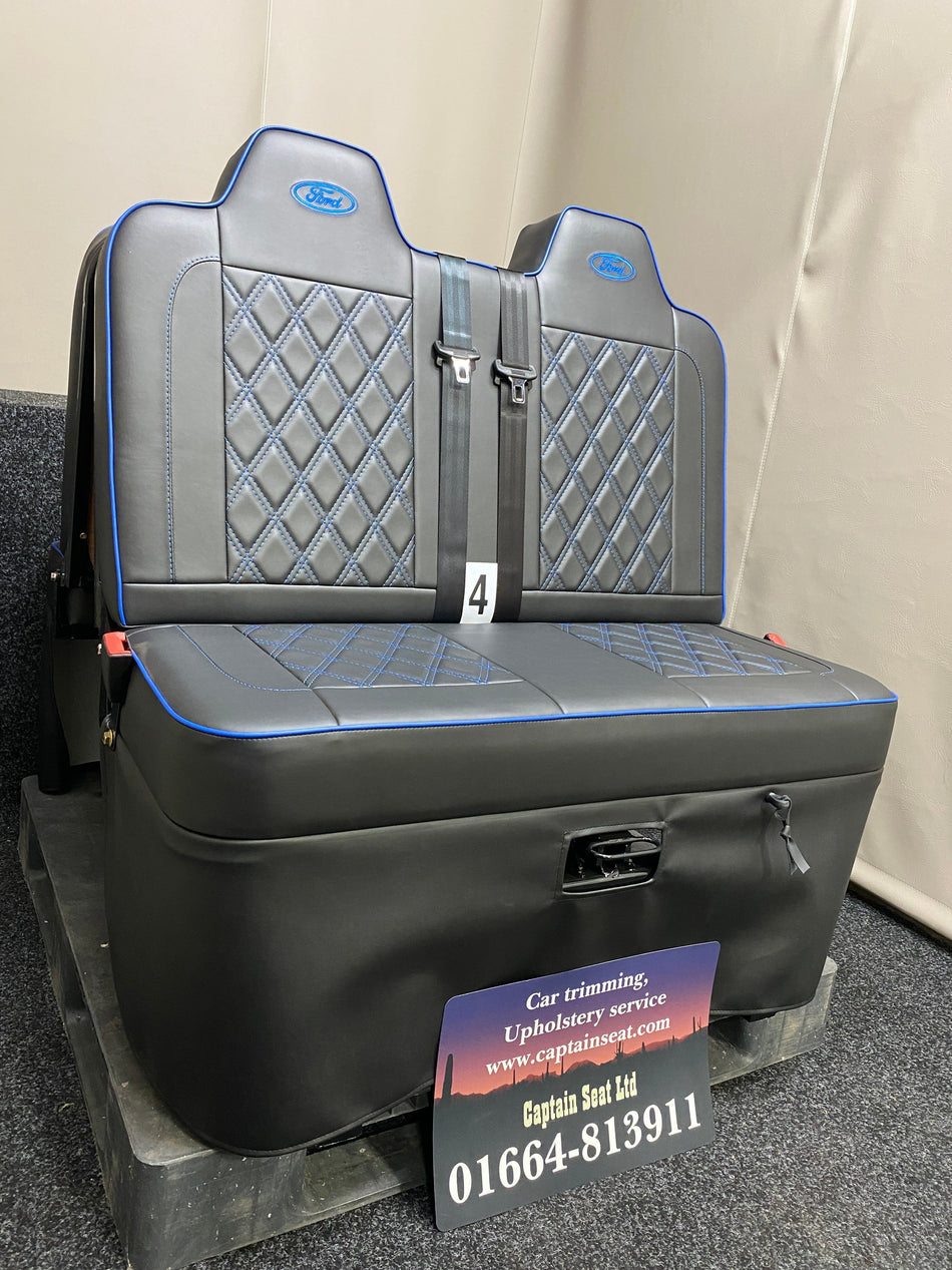 Rock & Roll Bed 3/4 M1 Tested 2 Seater – Gas Assisted Legged, angled side view of black leatherette seat with blue piping, Bentley stitching, and blue Ford logos.