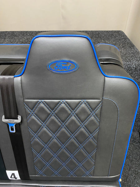 Rock & Roll Bed 3/4 M1 Tested 2 Seater – Gas Assisted Legged, close-up of backrest with blue Ford logo, blue piping, and blue Bentley stitcing.