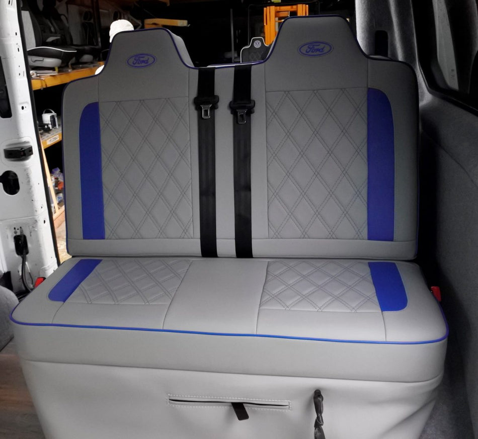 Rock & Roll Bed 3/4 Width M1 Legless Ford Transit in light grey leatherette, with blue inserts, piping and light grey Bentley stitching.