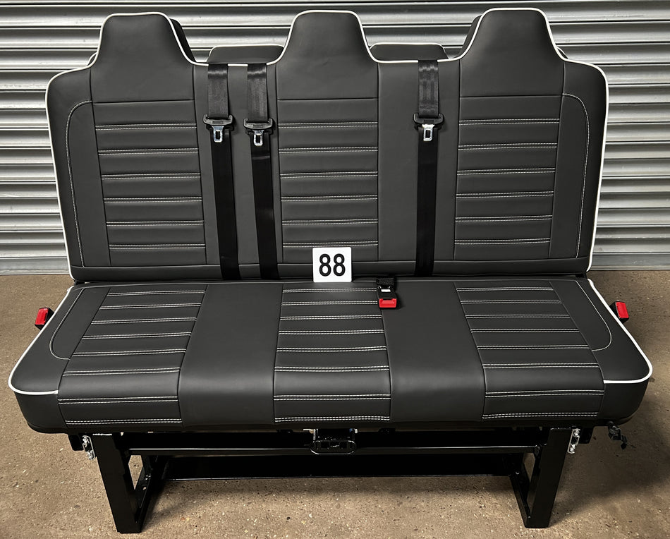 Rock & Roll Bed Full Size M1 Tested Deluxe – Legless Gas Assisted, front view in black leatherette with white piping and horizontal white stitching.