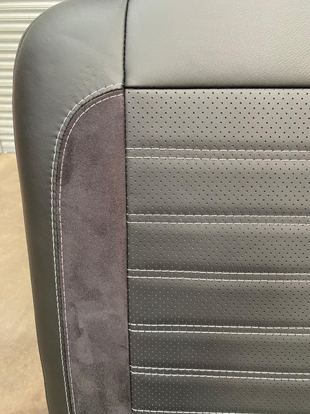Rock & Roll Bed Full Size M1 tested Legless Gas Assisted (56) close-up of backrest with perforated leather, black Alcantara insert, and light grey stitching.