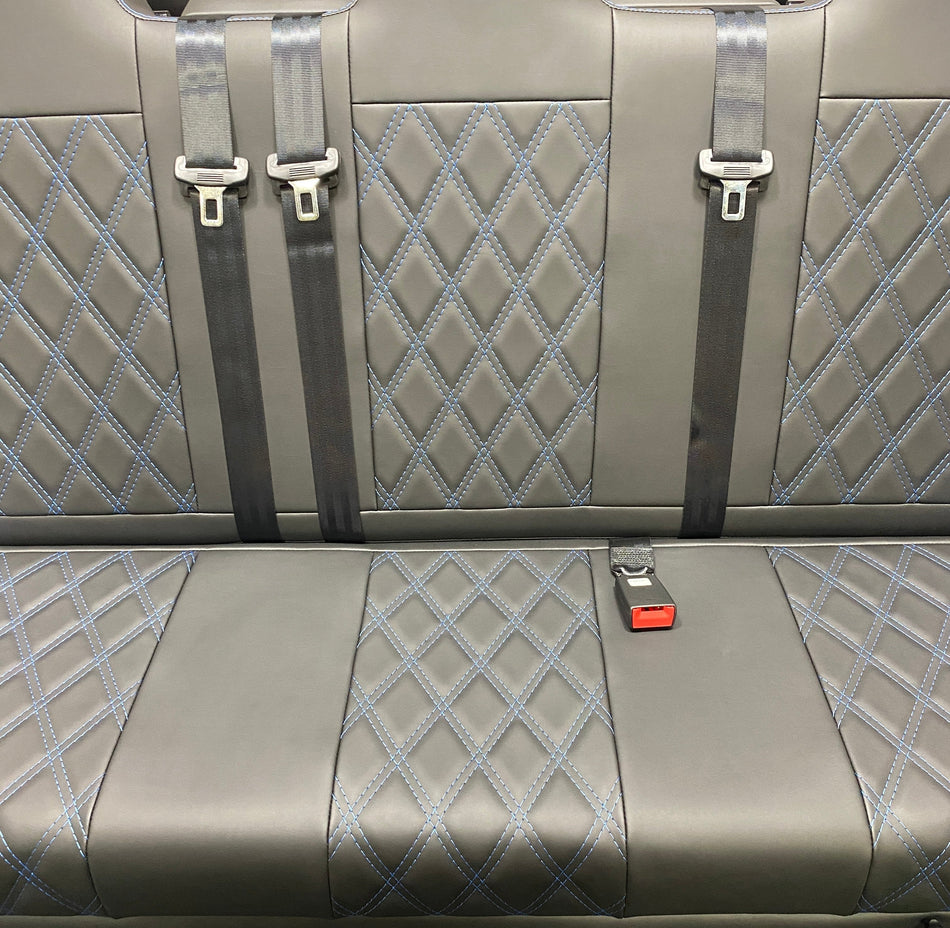 Rock & Roll Bed M1 tested Full Width Gas Assisted, close-up of black leatherette with Bentley cross stitching pattern and integrated seatbelts.