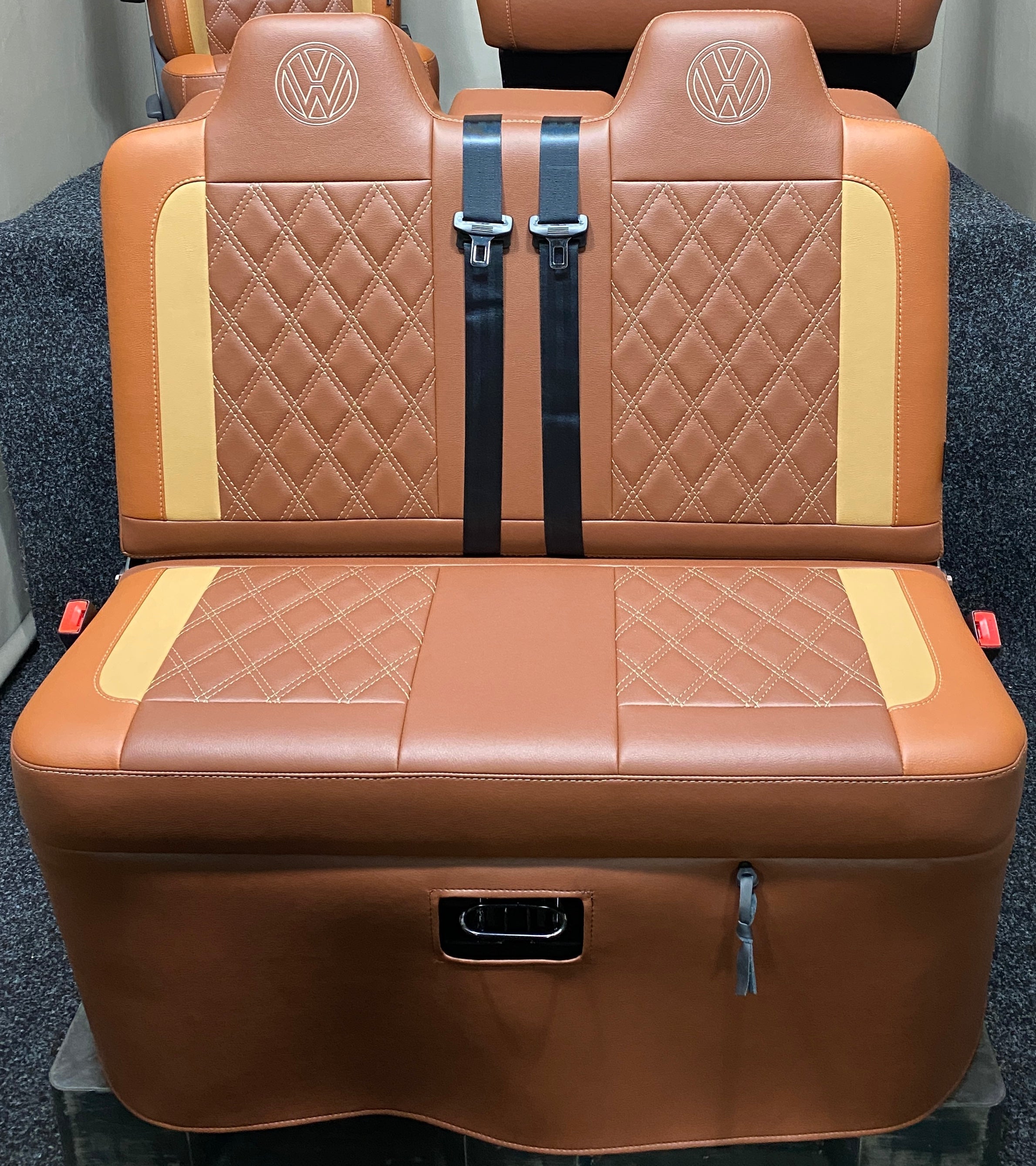 Rock & Roll Bed VW T4 T5 T6 Crafter M1 Tested 3/4, front view showing tan and toffee leatherette with Bentley stitching and VW embroidered logos.