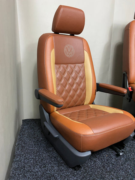 Factory Front Seat for VW T4 T5 T6, angled view with tan and toffee leatherette, Bentley stitching, VW logo and dual armrests.