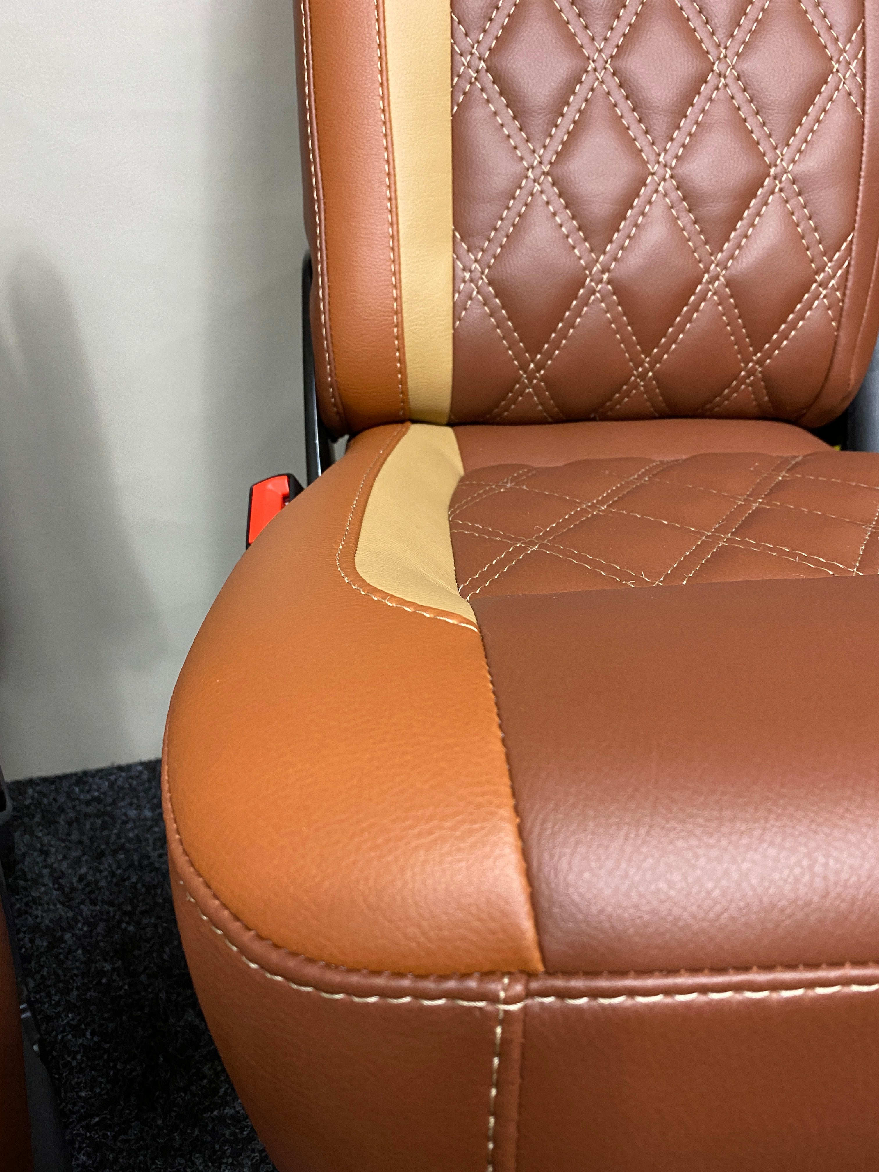Factory Front Seat for VW T4 T5 T6, close-up of seat base with Bentley stitching and contrasting tan and toffee leatherette panels.