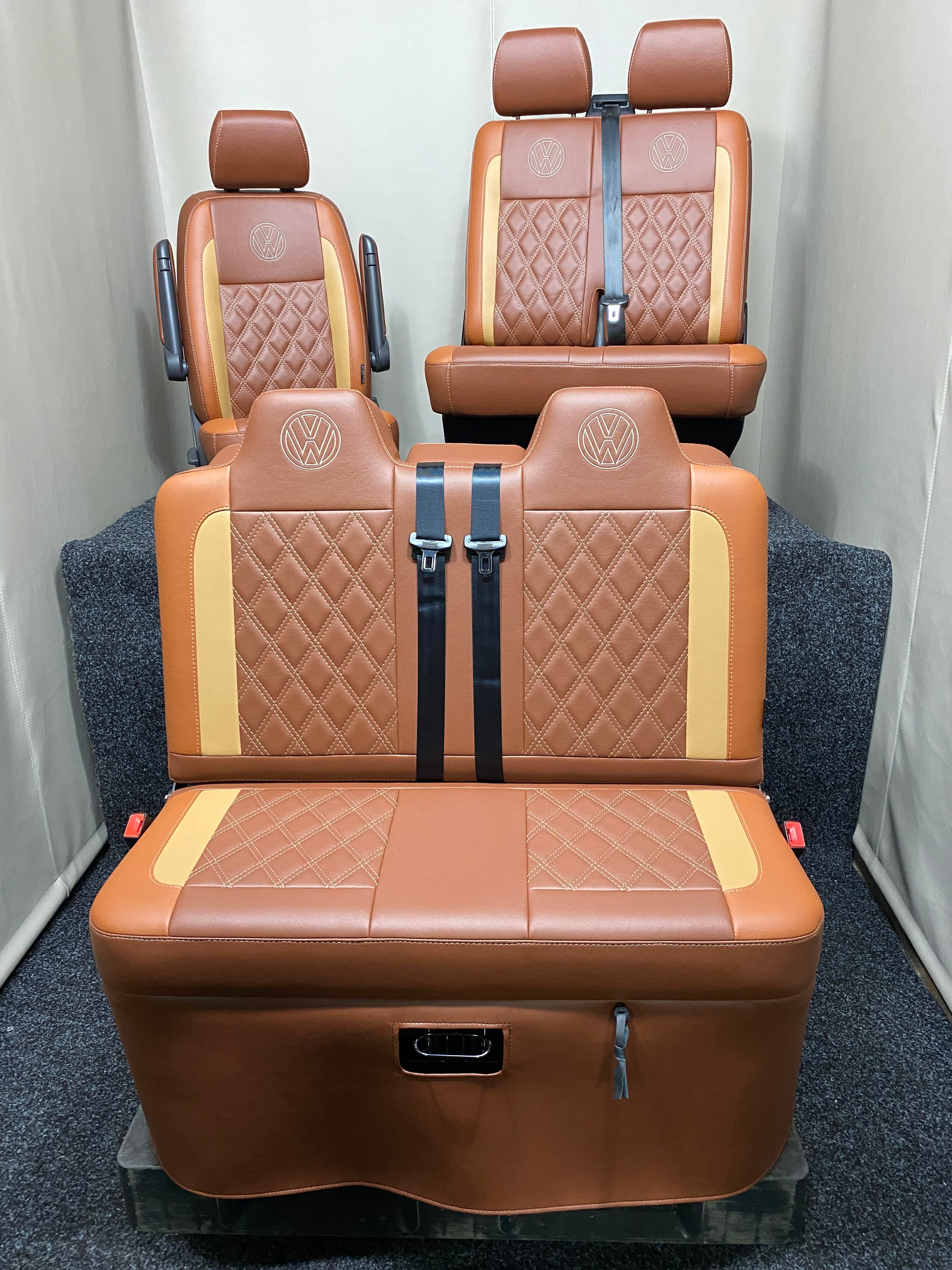 Rock & Roll Bed VW T4 T5 T6 Crafter M1 Tested 3/4 & Factory Front Seats, in tan and toffee leatherette with Bentley stitching and VW logos.