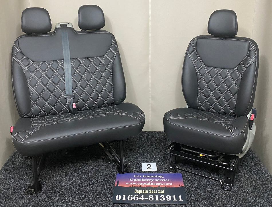 TVP Trafic Vivaro Primastar front seats in black leatherette with white Bentley stitching, shown in a full front-facing view.