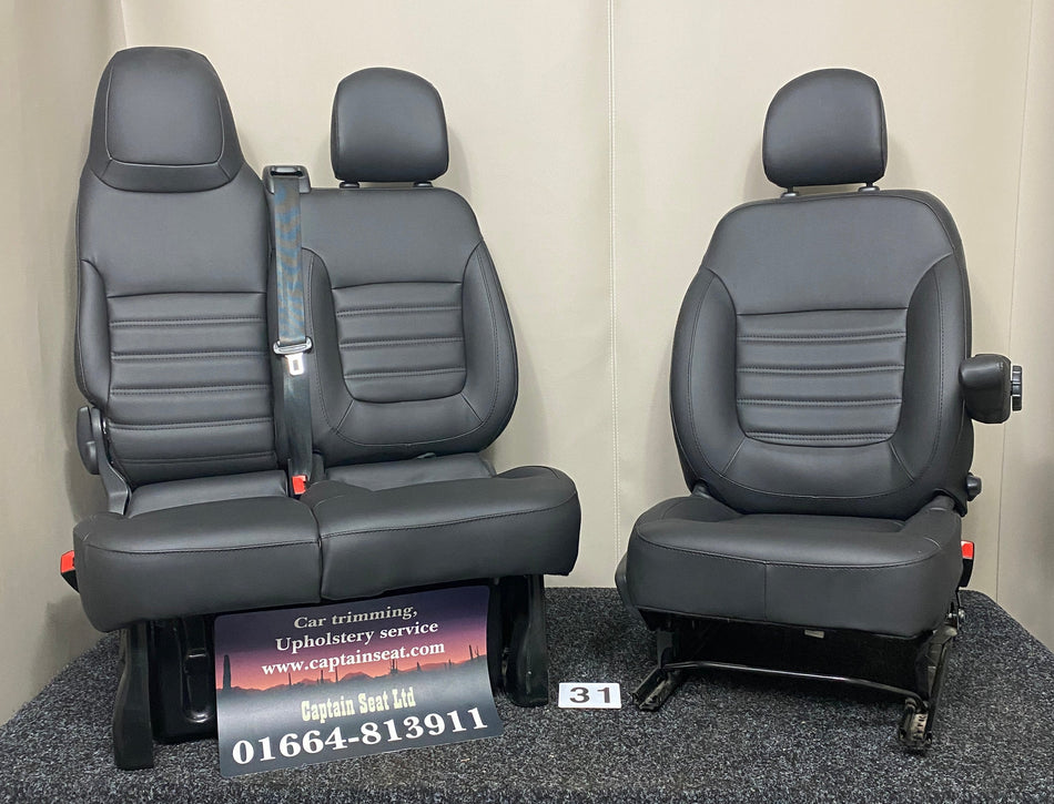 TVP Trafic Vivaro Primastar front seats in black leatherette with black horizontal wide stitching. Features a 2+1 seat configuration.