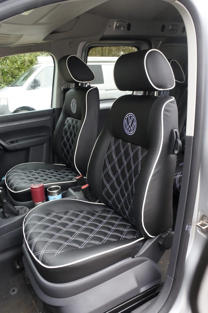 VW Caddy Seats Upholstery (VW-CADDY-01) in black leatherette with white Bentley stitching, white piping, and VW logos.