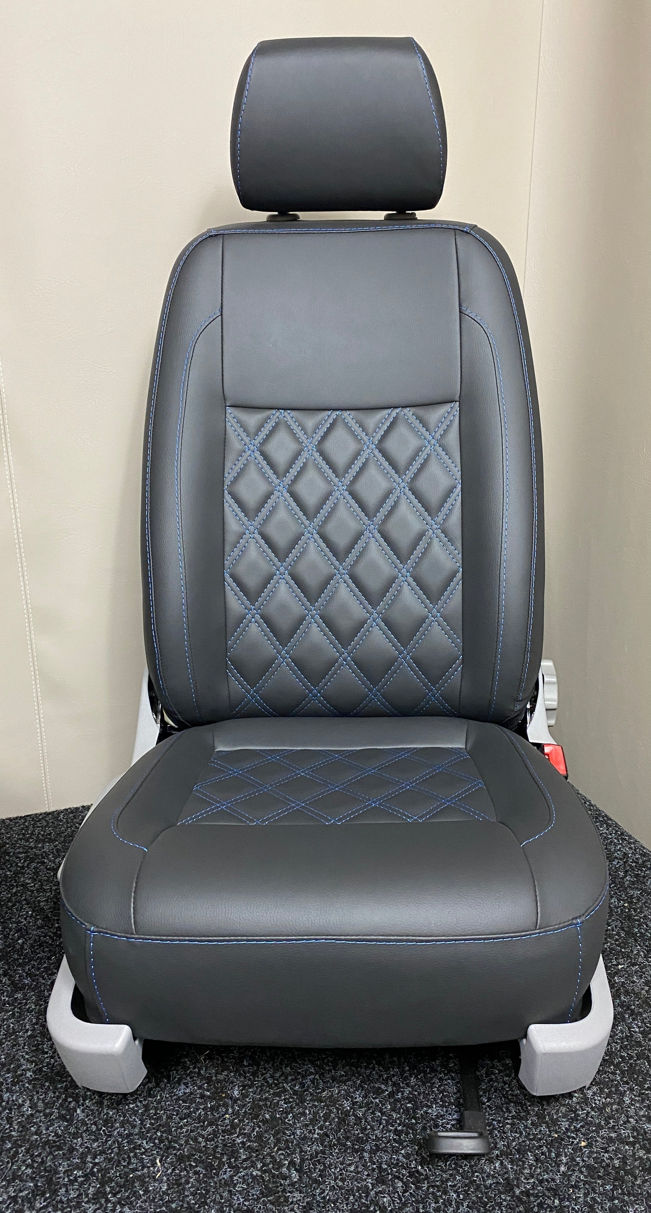 VW Factory Front Seat T5 T6 in black leatherette with blue Bentley cross stitching and light grey plastic trim.