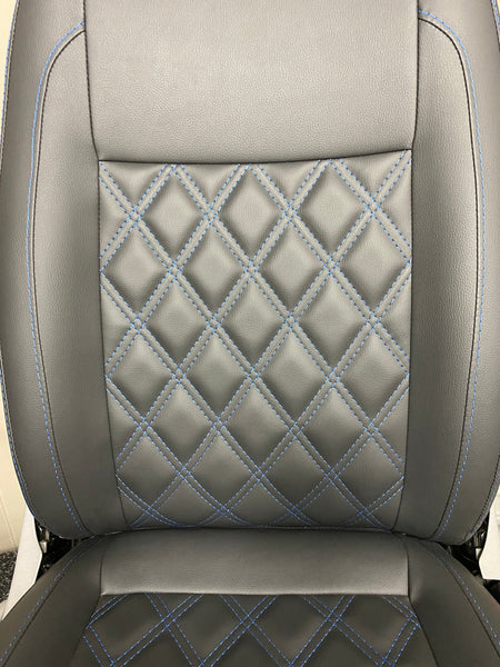 VW Factory Front T5 T6 Seat close-up of the backrest, highlighting the blue Bentley cross stitching on black leatherette upholstery.