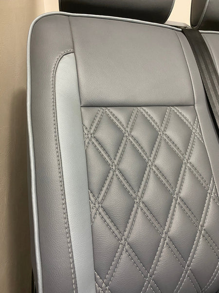 VW Factory Front Seats T5 T6, close-up of seat back with light grey leatherette insert and white Bentley cross stitching.