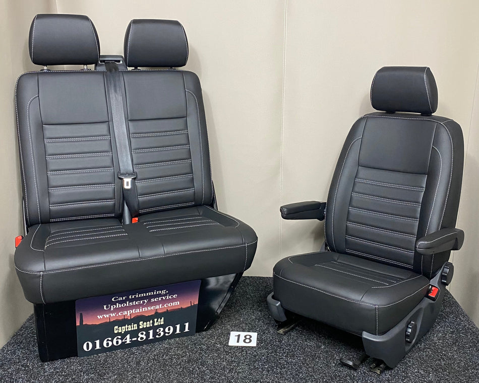 VW Factory Front Seats T5 T6, full view of black leatherette with white horizontal wide stitching, dark grey plastic trim, and visible armrests.