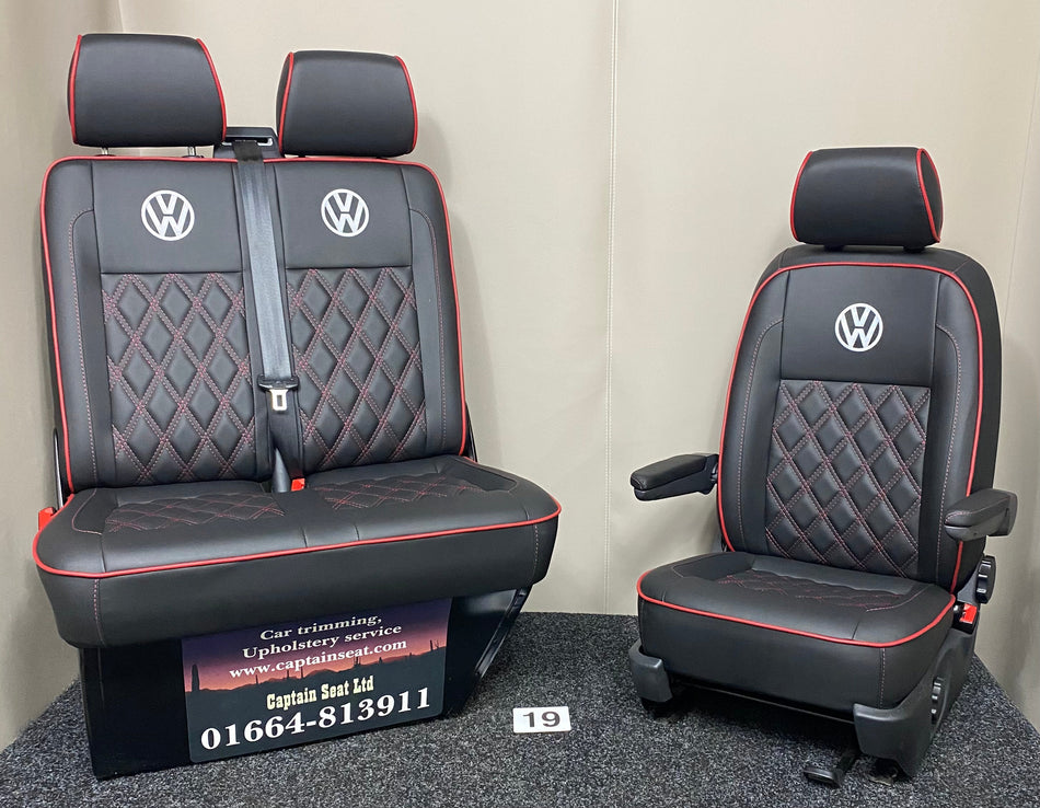VW Factory Front Seats T5 T6, full view of black leatherette with white VW logos, red Bentley stitching, dark red piping, and dark grey plastic trim.