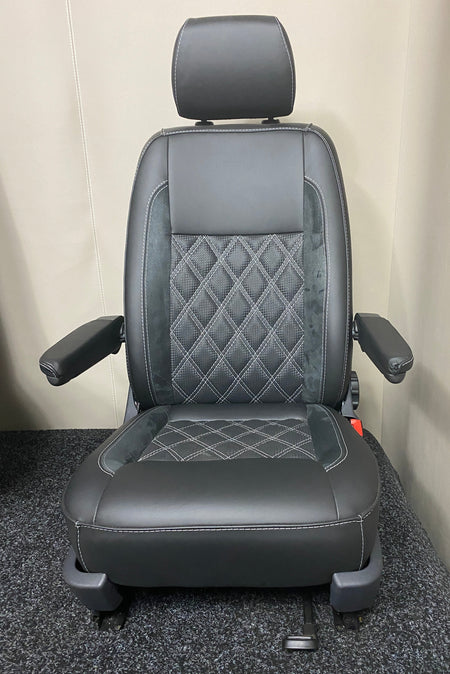 VW Factory T5 T6 driver seat in black real leather with black Alcantara inserts and carbon perforated centre panel, featuring light grey Bentley stitching and dual armrests.