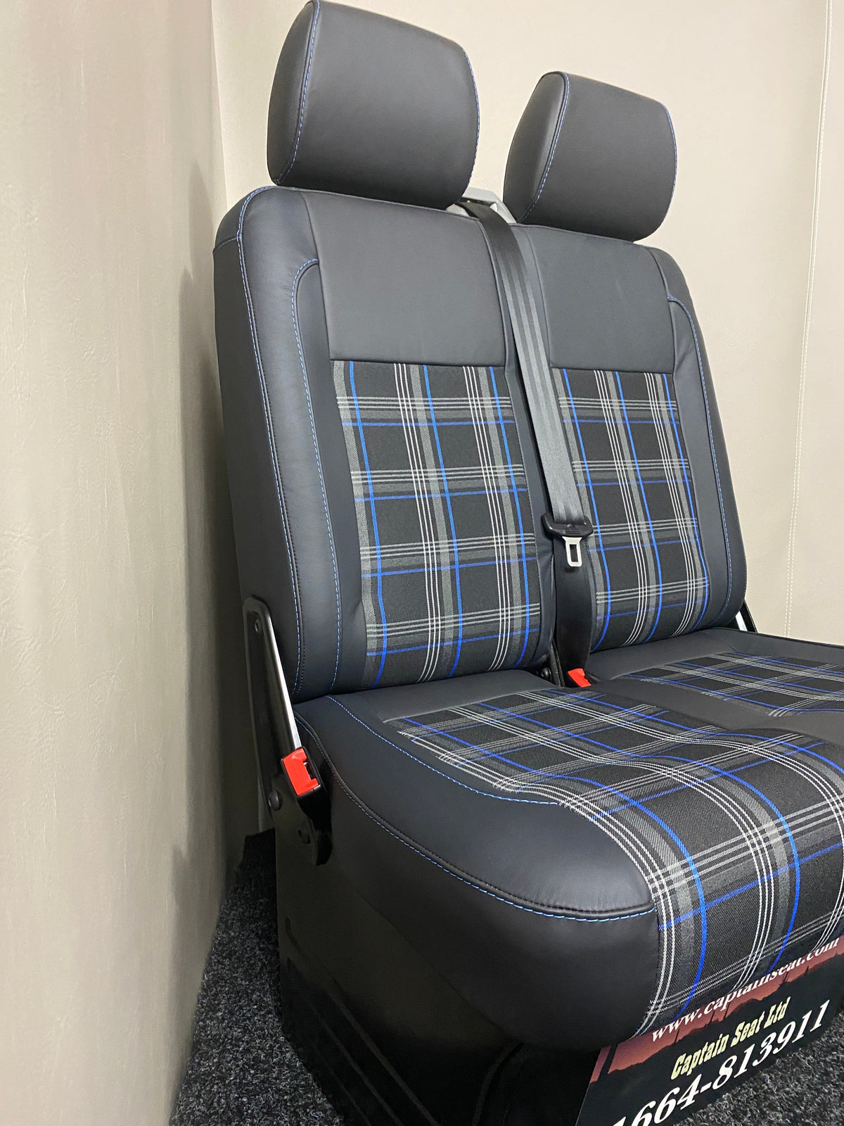 VW Factory Passanger Seats T5 T6 in  black real leather, with blue tartan centre panels, blue stitching, and light grey plastic trim.
