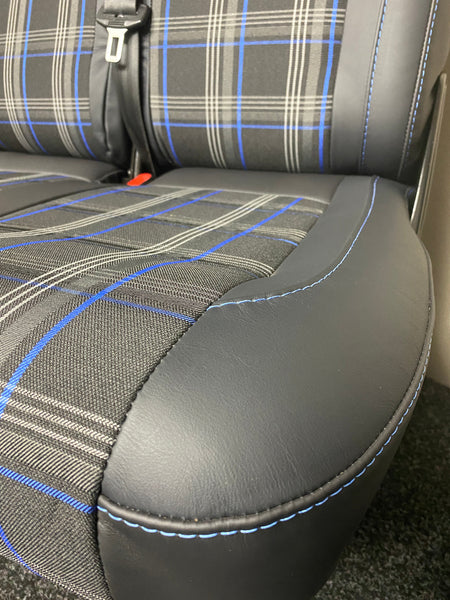 VW Factory T5 T6 Front Seat close-up of blue tartan centre panel and black real leather edge panel, featuring blue stitching.