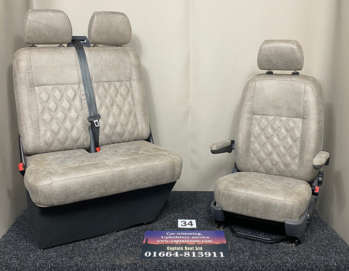 VW Factory T5 T6 Front Seats in beige faux suede with cream Bentley cross stitch, VW logo, armrests and dark grey plastic trim.