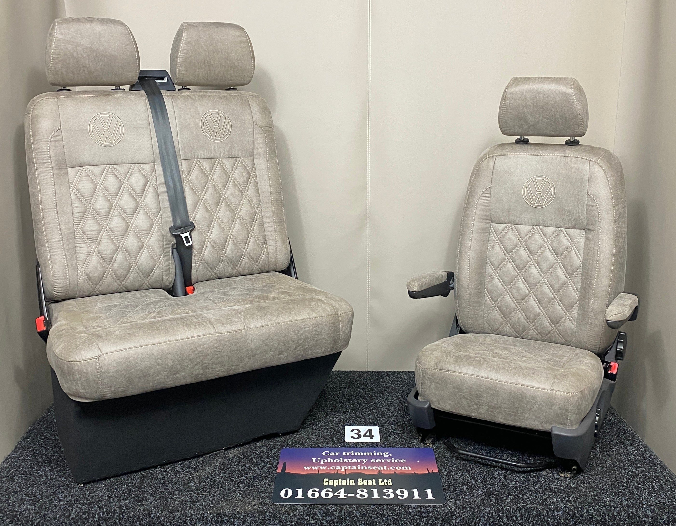 VW Factory T5 T6 Front Seats in beige faux suede with cream Bentley cross stitch, VW logo, armrests and dark grey plastic trim.