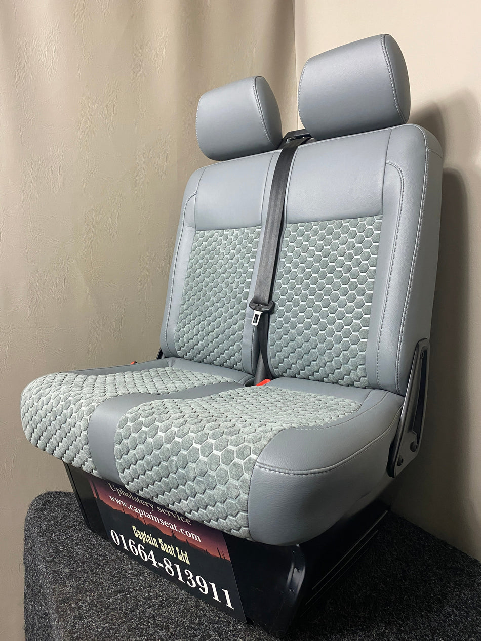 VW Factory T5 T6 passenger seats in grey leatherette with grey fabric honeycomb centre panels and grey stitching. Features an integrated seatbelt and dark grey plastic trim.
