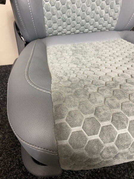 VW Factory T5 T6 seat close-up of grey leatherette side panel and grey fabric honeycomb seat base and centre panel.