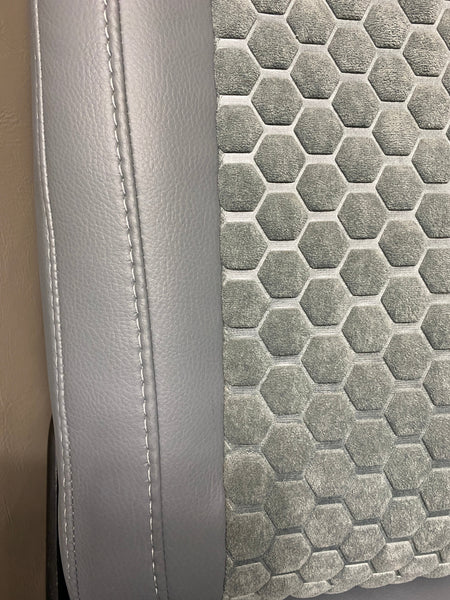 VW Factory T5 T6 seat close-up of grey leatherette side panel and grey fabric honeycomb centre panel with grey stitching.