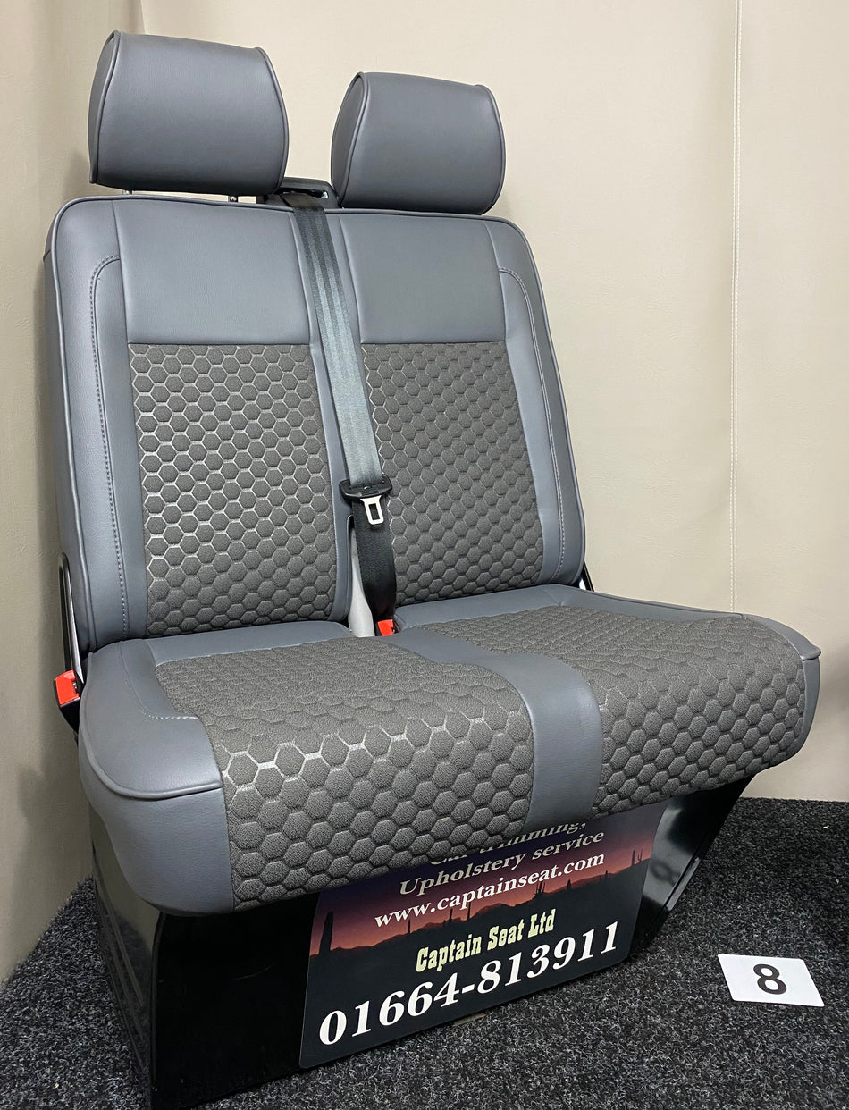 VW Factory Passenger Seats T5 T6, angled view of medium grey leatherette double seat with light grey inserts and grey Bentley cross stitching.