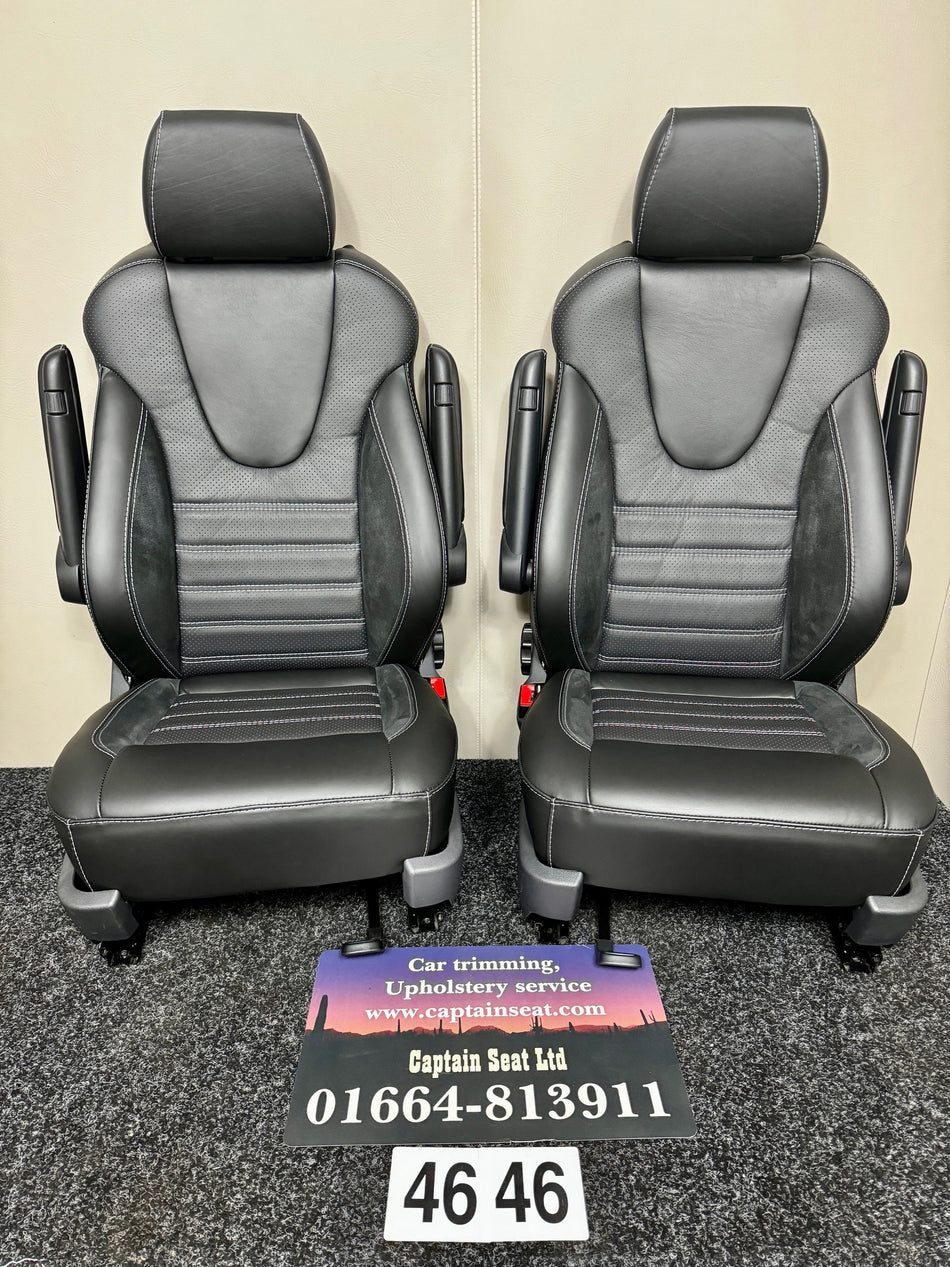  VW T5 T6 Factory Front Seats with Winged Backrests in black Nappa leather, Alcantara inserts, perforated leather center panel, light grey horizontal stitching and dual armrests.