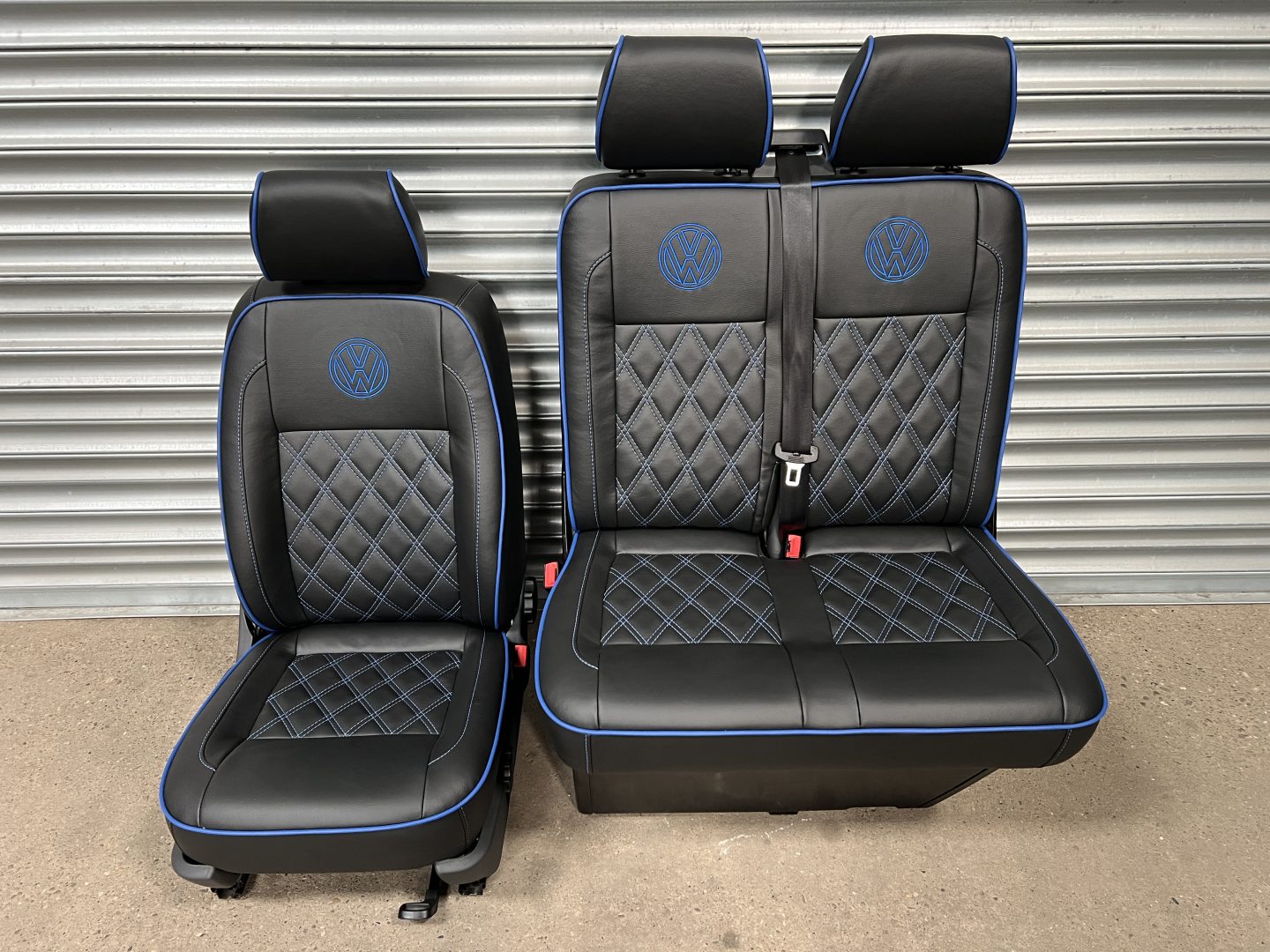 VW T5 T6 front driver and double passenger seat in Black leatherette with blue cross stitching, piping and VW logos.