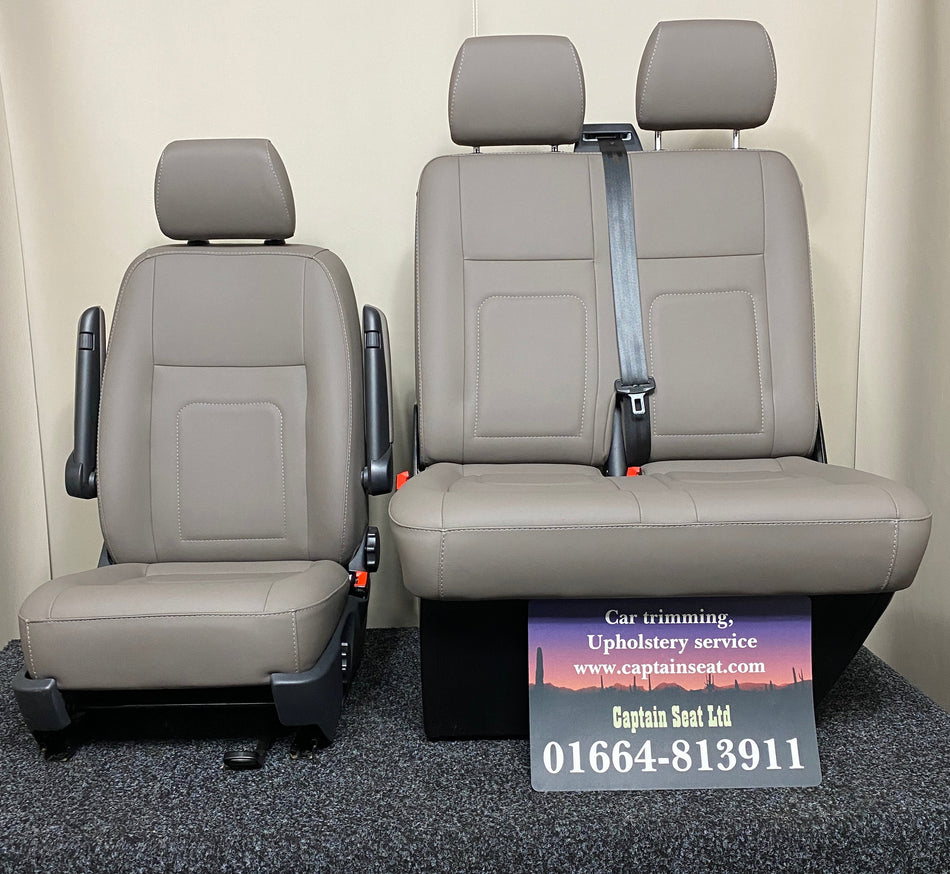 VW T5 T6 Front Seats, upholstered in light grey leatherette with customised stitching, featuring integrated seatbelts and armrests.